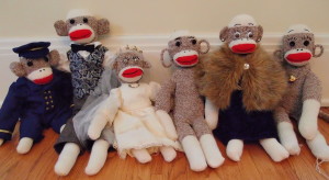 Sock monkeys Captain Eugene, Sir Rudyard, Miss Beatrice, Ebenezer the Lighthouse Keeper, Dame Lorraine, and Throckmorton