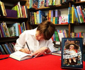 Eileen Autographing a Copy of Secrets