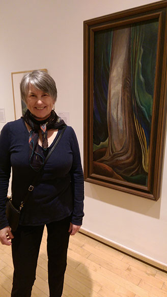 Eileen standing next to Tree Trunk, 1931, oil on canvas, at Vancouver Art Gallery